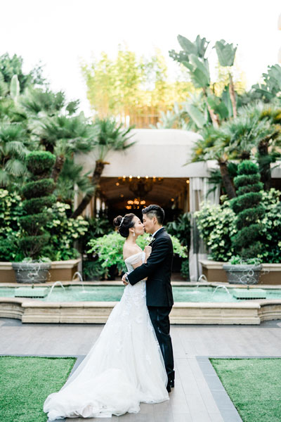 Custom Preset on Wedding Portrait of Couple in Front of Fountain Edited by Photographer’s Edit