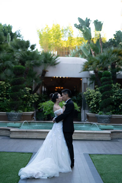 Underexposed Wedding Portrait in Front of Fountain