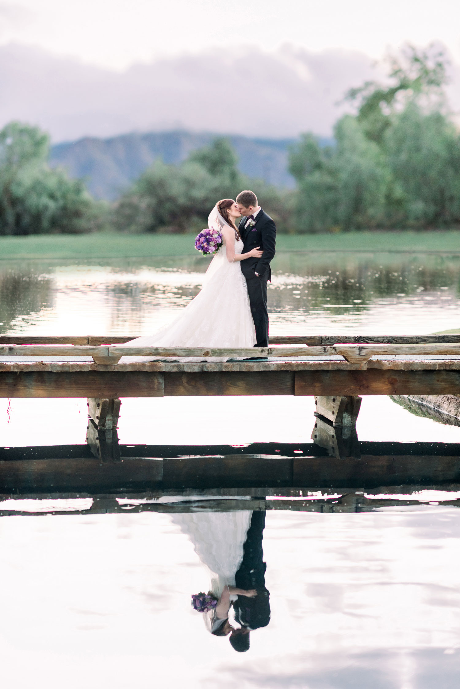 Custom Retouched Photo with Background Swap on Wedding Portrait of Couple on Bridge