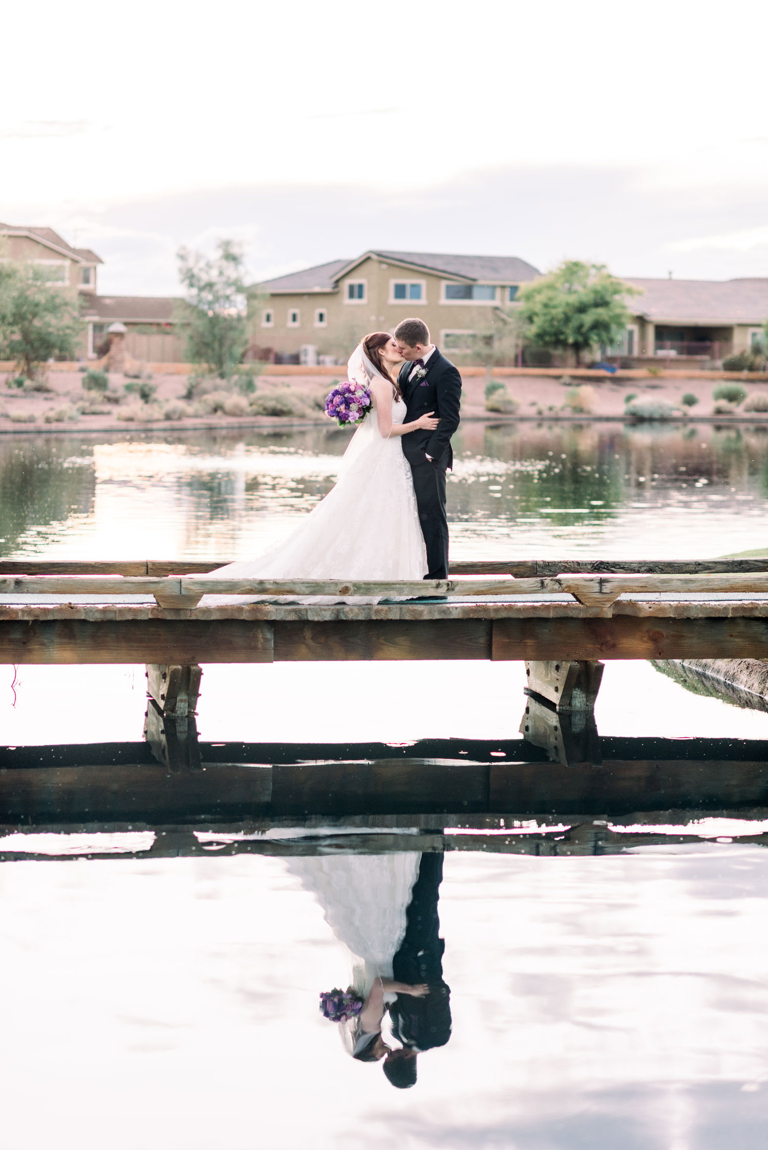 Wedding Portrait on Bridge In Neighborhood